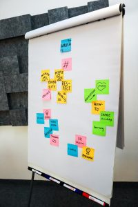 Bright sticky notes on a whiteboard for a creative office brainstorming session.